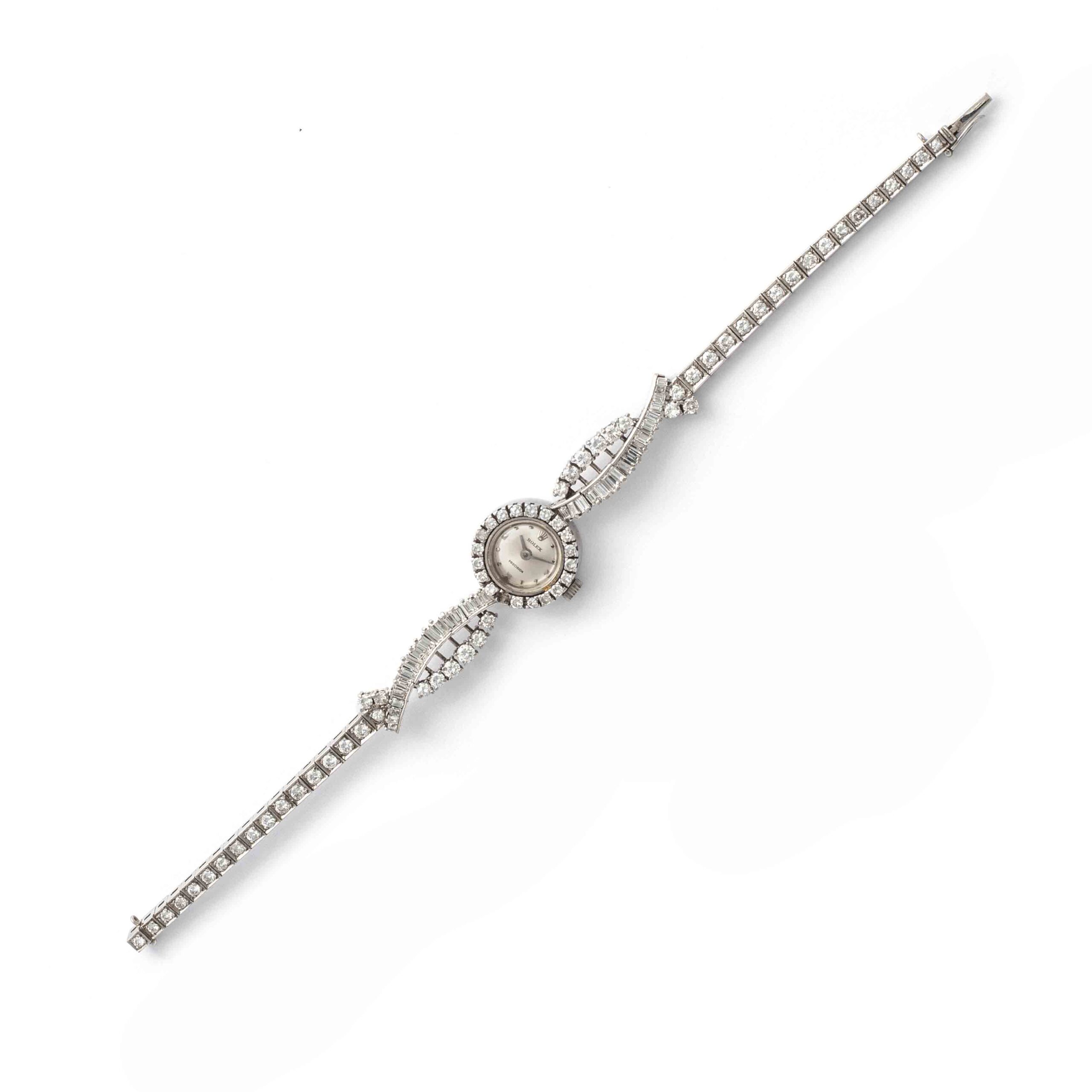 Rolex Diamond round and baguette cut on white gold 18K wristwatch. Circa 1950. Rolex. Numbered. Rolex Précisions. Total gross weight