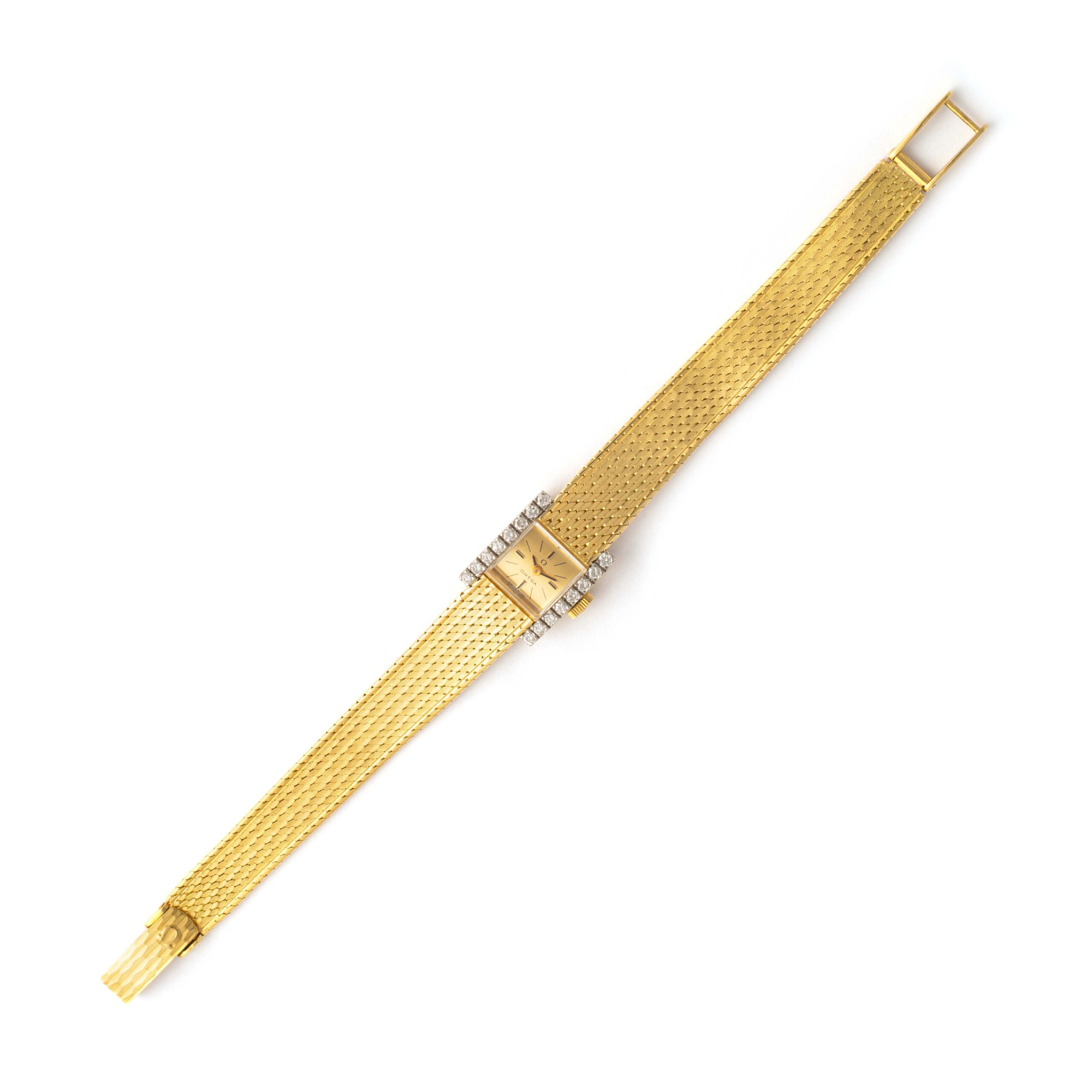 Front view Omega Diamond and Yellow Gold 18K Wristwatch. Circa 1970. 16 round cut Diamonds. Manual winding mechanical movement.